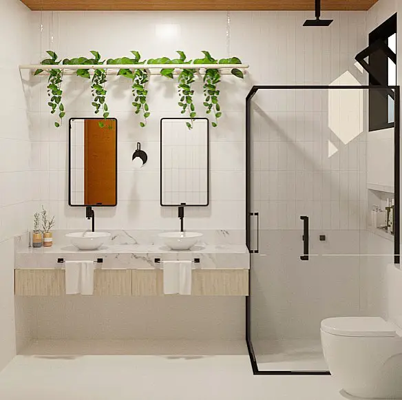 Banheiro com duas cubas e decoração com plantas