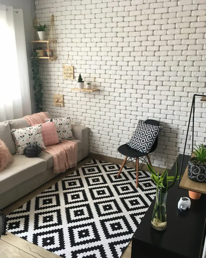 Sala pequena decorada em preto e branco